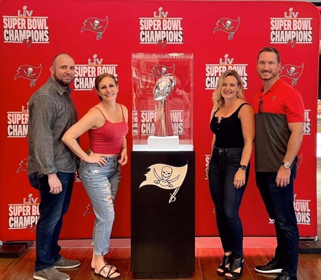 The Taylor and Everritt families at a Buccaneers game