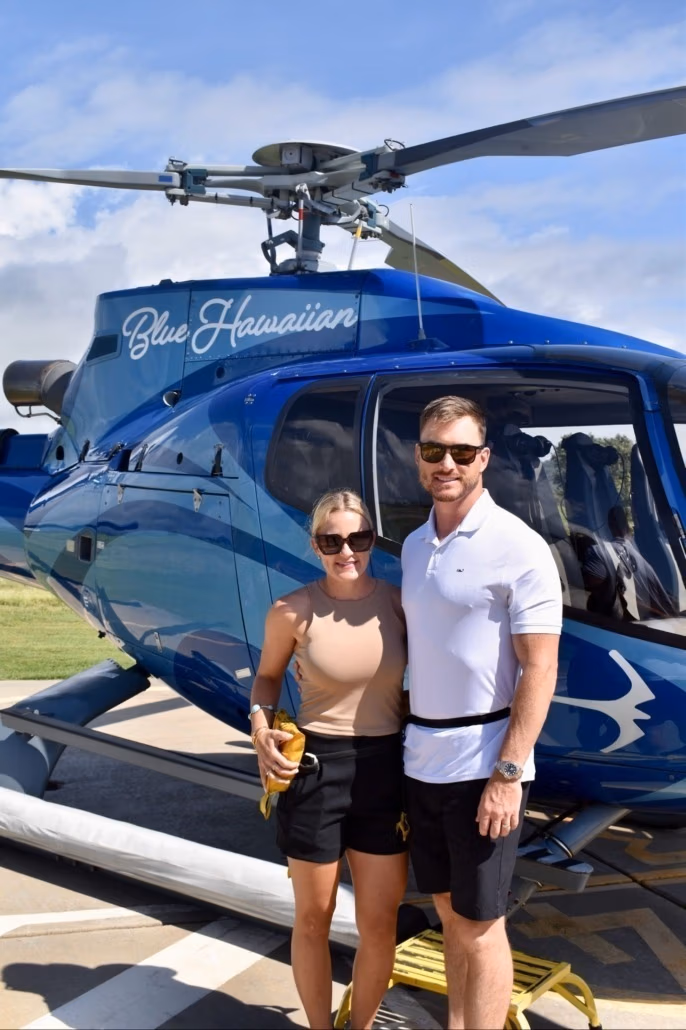 Adam and Andi on a helicopter